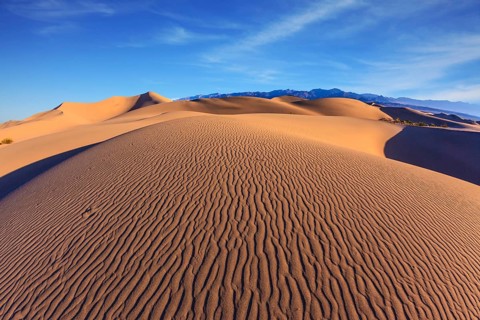 Bright sunny morning in a picturesque part of Death Valley. Thin waves on the sand. Mesquite Flat