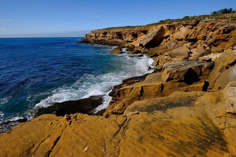 Rocky coast on the Atlantic Ocean between Burgau and Luz, Algarve, Portugal