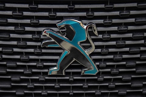 WETZLAR, Germany 2022-04-23: Peugeot logo closeup on a car grill. Peugeot as car manufacturer was