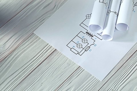 Electrical blueprints on vintage white wood