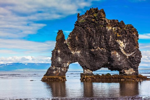The picturesque cliff in Iceland as huge prehistoric monster. Remains of an ancient extinct volcano