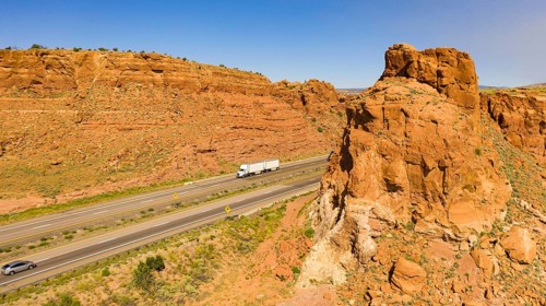 Vehilces Travel along close to the Laguna Pueblo along highway 40 in the desert southwest