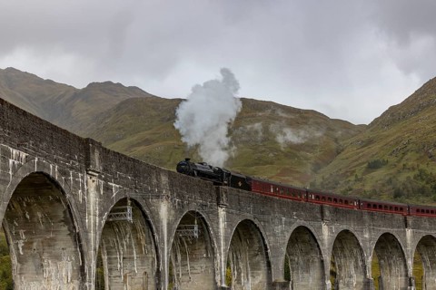 The Jacobite Steam Train, steam railway on the Glenfinnan railway viaduct, known from Harry Potter,