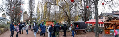 Panoramic photo Christmas market on the Louise-Weiss island square in the old town and the