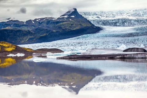 Glacier meltwater form a picturesque lake. The sunset over the Iceland's largest glacier