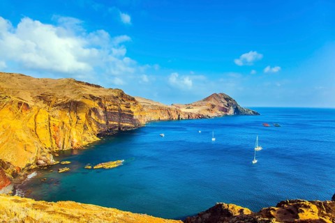 The west coast of Madeira - the bay between the rocks with yachts and boats. Madeira is island in