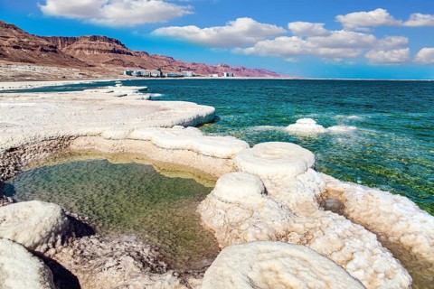 Evaporated salt forms crystals on the surface of the water. The saltiest lake in the world. Dead