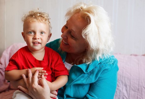 Happy grandmother with her little grandson