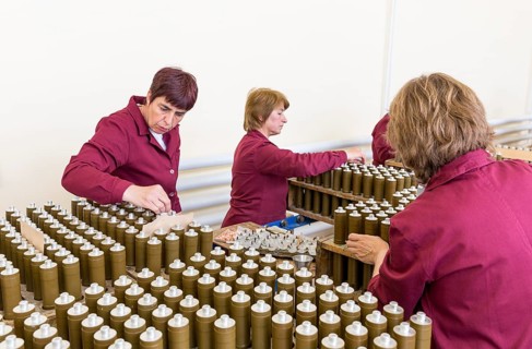 Sopot, Bulgaria - May 17, 2016: Female workers are checking explosive elements of anti tank
