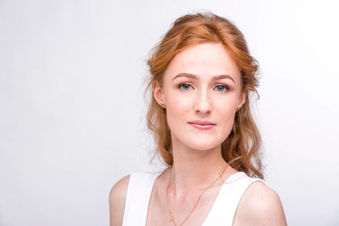 Portrait of a beautiful young woman of European, Caucasian nationality with long red hair and