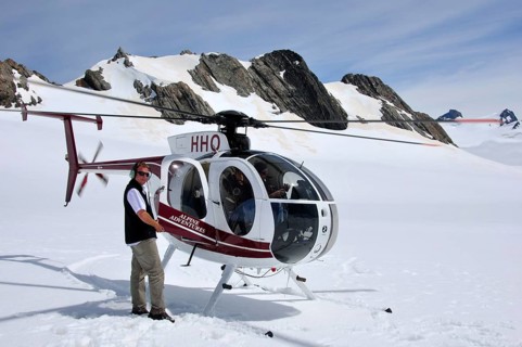 FRANZ JOSEF GLACIER, NEW ZEALAND: DECEMBER 24, 2009: Pilot welcomes passengers aboard his