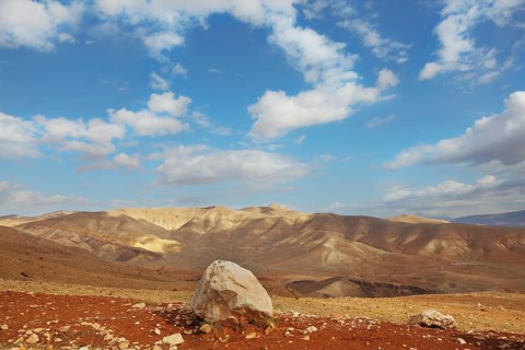 Gorgeous clear day in the Judean desert. Huge boulders along the roads, clear skies