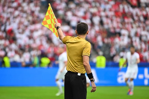 Assistant of football referee during the match