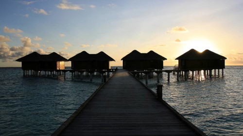 Water bungalows at sunset, Kandoludu, Maldives Maldives