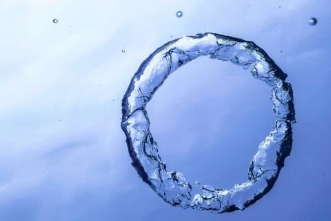 Underwater Bubble Ring Ascends towards the Sun