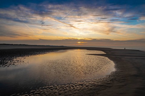 Sunset over the North beach of Borkum with beautiful sky