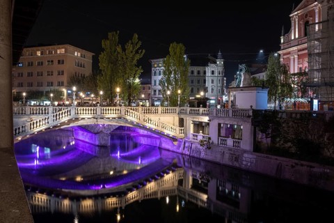 Famous three bridges at the Preseren square in the center of Ljubljana colorfully illuminated at