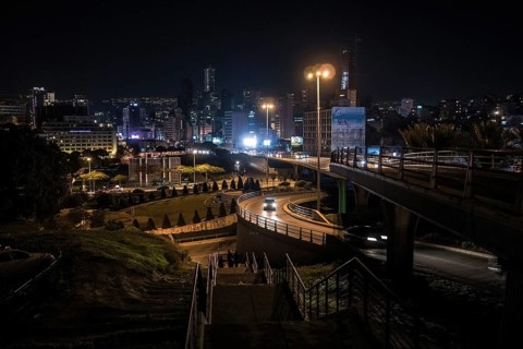 Cars drive at night on the Beirut Central Ring Road, one of the most important transport links in