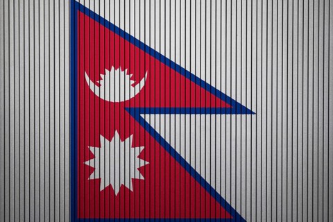 Nepal Flag painted on the cracked grunge concrete wall
