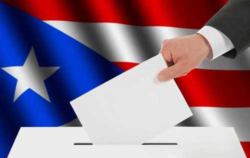 The Puerto Rico flag and the hand with the bulletin about the ballot box