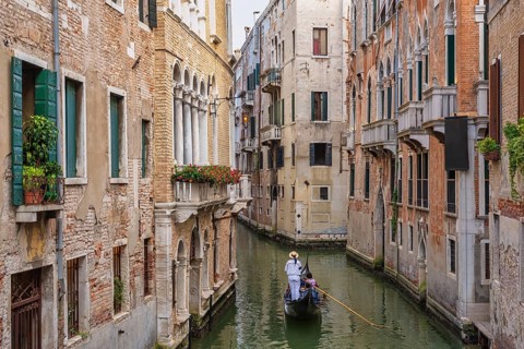 Venice Italy, city skyline at canal in Venice with Gondola boat
