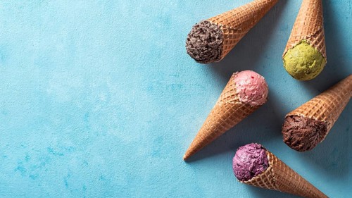 Various ice cream scoops in cones with copy space. Colorful ice cream in cones chocolate,
