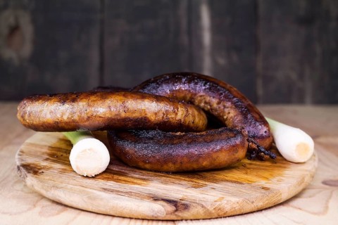 Fried Sausages On a Wooden Board