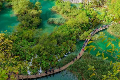 People walking on the trekking path at Plitvice Lakes National Park (Plitvi?ka Jezera), a national