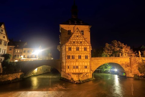 Obere bridge (brücke) and Altes Rathaus at night in Bamberg, GermanyObere bridge and Altes Rathaus