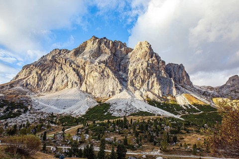 The majestic pass in the Eastern Alps of Falzarego. Picturesque sunset in the colorful rocks of the