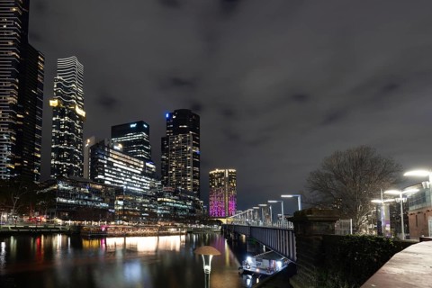 MELBOURNE, AUSTRALIA - JULY 5, 2024: Melbourne skyline as seen at dusk from Sandridge Bridge near