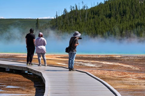 Tourists On Grand Prismatic Spring In Yellowstone National Park, Wyoming, USA, USA