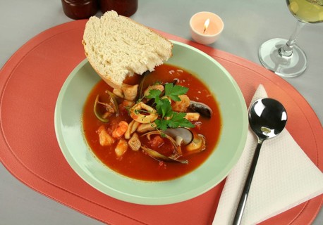 Delicious Mediterranean style tomato seafood soup with a variety of mixed seafood
