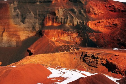 Martian landscapes in Iceland. The red crater of The Seydisholar volcano. The quarry of red soil