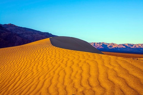 Mesquite Flat Sand Dunes - dunes in Death Valley, USA. Morning light illuminates the soft sandy