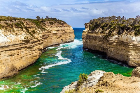 The Great Ocean Road of Australia. Coastal rocks are composed of sandstone. Small ocean fjord with