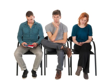 Young people are waiting in a room