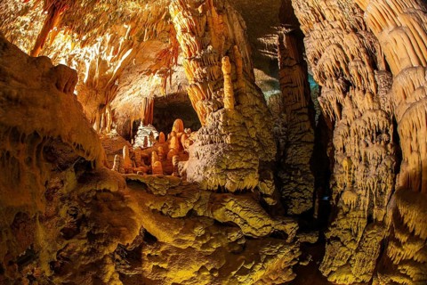Postojna Cave. Colossal system of underground caves in Slovenia. Limestone plateau in Slovenia.