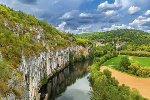 Landscape with rocky shore of Lot river, France