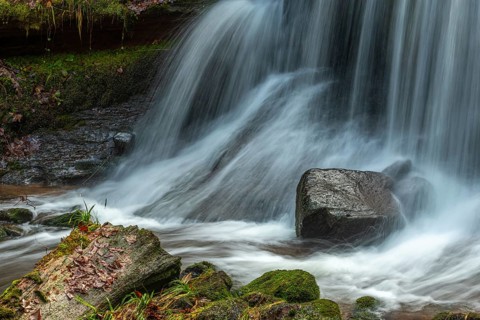 Fresh water waterfall on rocks moss cover in mountain. Fresh water waterfall on rocks moss cover in