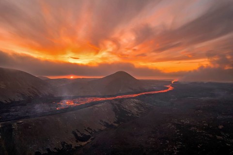 Drone image of a volcanic eruption in the evening light in Grindavik, Sudurnes, Iceland