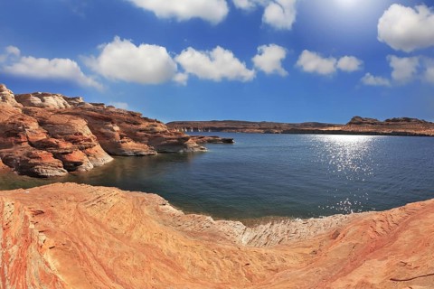 Photo taken fisheye lens. Midday heat. The artificial Lake Powell in the red desert of California