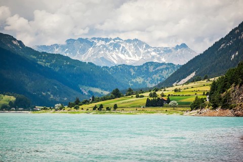 An image of the church tower in the Reschensee Italy