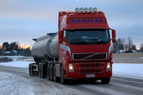 SALO, FINLAND, JANUARY 15, 2017: Red Volvo FH tank truck for bulk transport delivers a load along