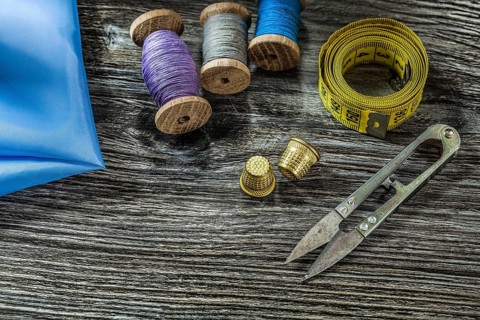 Metal scissors thimbles spool threads measure tape