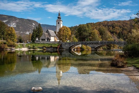Old church St. John the Baptist at Lake Bohinj in the Triglav National Park, The Julian Alps,