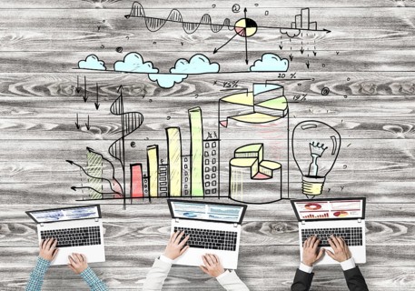 Group of people with devices in hands working together as symbol of networking and communication