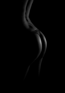 Rear view of sexual female body in black lingerie. Black and white photo