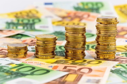 Stack of coins, rising curve, symbolic photo for rising profits and also rising costs Austria