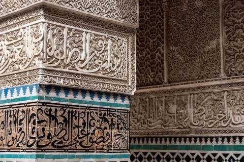 Fes, Morocco, April 04, 2023, Rich decorated facade in the courtyard of the Medersa Attarine in